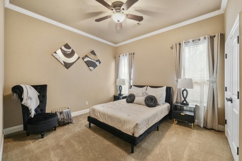 Vi'Lou staged primary bedroom with elegant bedding